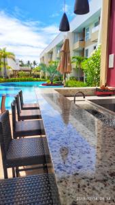 Guarajuba Porto Smeralda Village C02, térreo - GUARAJUBA TEMPORADA, viva mais de uma experiência de hospedagem conosco! 130m da praia