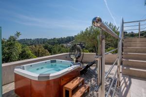 Uniquely designed Villa Ivana with outdoor Jacuzzi nearby the pebble Banje beach at the Island of Solta