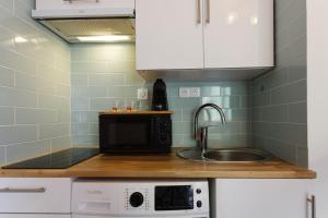 Appartements L'ecrin, Studio Cosy, MBS, Wifi, Parking, Clim : photos des chambres