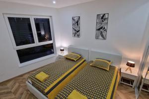 Appartements AOG PRESTIGE logement neuf avec SPA et ecran de cinema en rez de jardin : photos des chambres