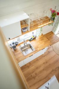 Green Tiny House with shared pool