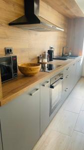 Modern Apartment with Fireplace & Stylish Kitchen