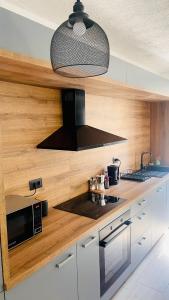 Modern Apartment with Fireplace & Stylish Kitchen