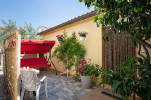 Modern stone House with flowers & playground