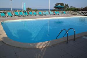Maisons de vacances Villa dans residence avec piscine, tennis et direct a la plage en Corse : photos des chambres
