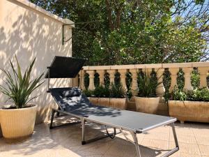 Appartements Cote Jardin est un spacieux et lumineux T3, entierement renove, a 2 pas de l'Herault et a 10min du bord de mer Proche du centre historique et du fabuleux chateau Laurens, vous apprecierez le calme de sa belle terrasse et la vue superbe sur le jardin : photos des chambres