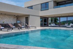 Luxury beachside villa with a pool and a sea view