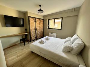 Le Loft Manhattan, en centre ville, proche Sainte Bernadette avec Parking