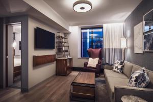 One Bedroom King Suite with 1 King Bed, Sofa bed room in Rand Tower Hotel Minneapolis a Marriott Tribute Portfolio Hotel