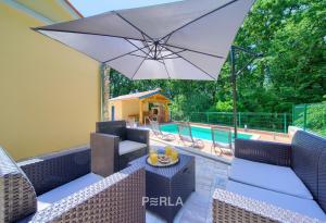 Cozy holiday house CAPREE with pool in a quiet location near the beach Rabac