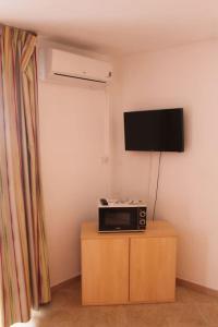 Appartements Grazioso bilocale a 200 m dal mare in residence con piscina e WI-FI : photos des chambres