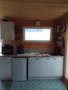 Appartements Tiny house dans jardin arbore : photos des chambres