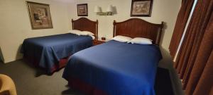 Queen Room with Two Queen Beds room in Husker Inn
