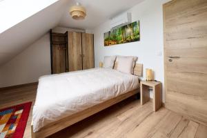 Appartements Le Pommier - Appt avec jardin partage : photos des chambres