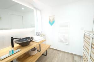 Appartements Vaiana YourHostHelper : photos des chambres