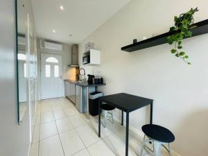 Appartements The studio-Climatisation-Wifi : photos des chambres