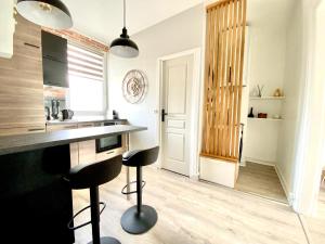 Appartements chaleureux - 15 min a pied de la gare : photos des chambres