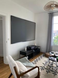 Appartements Cinema prive/ Proche Paris/Orly : photos des chambres