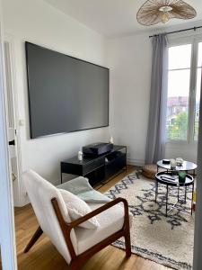 Appartements Cinema prive/ Proche Paris/Orly : photos des chambres