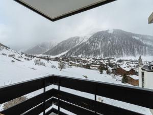 Grand appartement à Val-dIsère : 4 pièces, 95m², 7 pers, balcons, parking, exposé Sud-Est - FR-1-567-4