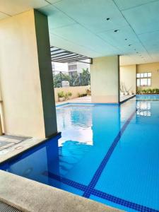 Modern Spacious 2BR Condo with Wifi at Aurora Gardens San Juan City near Rob Magnolia