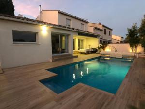 Villas VILLA FLAVIE- Luxueuse - Confort Jardin Barcecue Borne Recharge Electrique 10min PLAGE- FAMILLE-PISCINE-TOP PROS SERVICES Conciergerie : photos des chambres