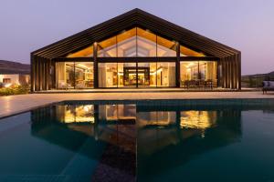 StayVista's The Barn - Mountain-View Luxury Mansion with Heated Infinity Pool, Deck, Jacuzzi, Lawn featuring a Gazebo and Firepit