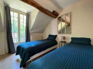 Appartements L’ecurie de Fontainebleau - jardin : photos des chambres