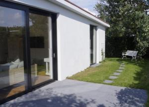 Wellenklang - Luxusbungalow mit Rosengarten