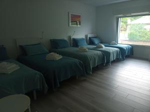Chambre Quadruple avec Salle de Bains Privative