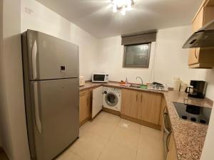 Lovely first floor tow bed rooms overviewing circular pool for families only in Talabay Aqaba
