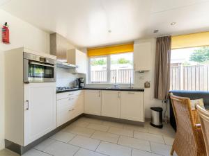 Holiday home in Baarland with garden