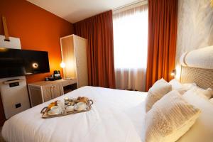 Hotels Kyriad Prestige Hotel Clermont-Ferrand : photos des chambres