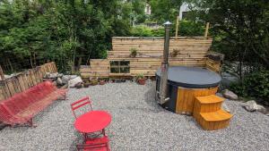 Riverside cabin with private terrace + hot tub