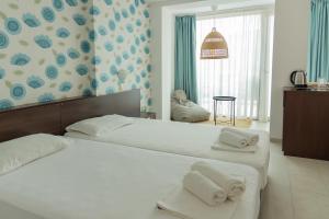 Double Room with Balcony and Sea View room in Ema Hotel