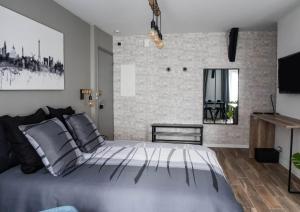 Appartements Beau studio STYLE INDUSTRIEL : photos des chambres