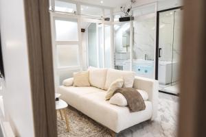 Appartements Evasion Chic - Spa prive & Cinema : photos des chambres