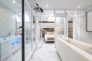 Appartements Evasion Chic - Spa prive & Cinema : photos des chambres