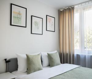 Nowogrodzka Grey Apartment by BookingHost