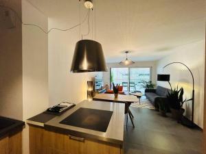 Appartements L’Hermine, parking & terrasse : photos des chambres