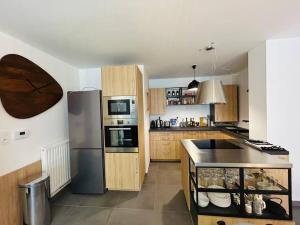 Appartements L’Hermine, parking & terrasse : photos des chambres