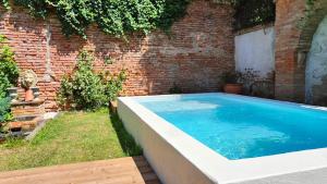 Appartements Le Jardin Secret - Piscine - Clim - Haut de gamme : photos des chambres