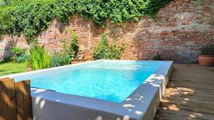 Appartements Le Jardin Secret - Piscine - Clim - Haut de gamme : photos des chambres