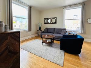 Downtown Digs-View of the City! Stay above local restaurants and nightlife, posh amenities heated toilet seat, oversized rain shower head in glass shower, in-unit laundry, one garage parking spot