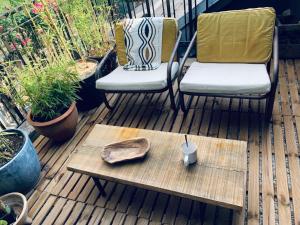 Appartements La Cabane Urbaine et sa terrasse : photos des chambres