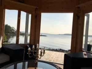 Cottage with own beach, seaterrace & pavillion.