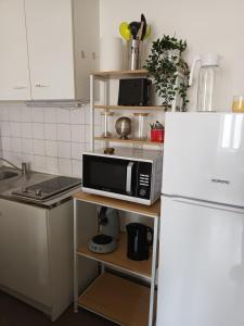 Appartements Logement cosy, une chambre avec patio : photos des chambres