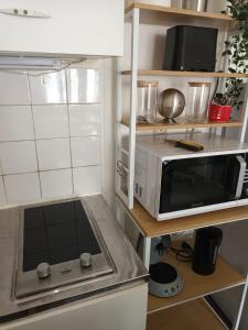 Appartements Logement cosy, une chambre avec patio : photos des chambres