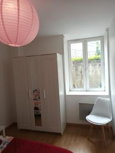 Appartements Logement cosy, une chambre avec patio : photos des chambres