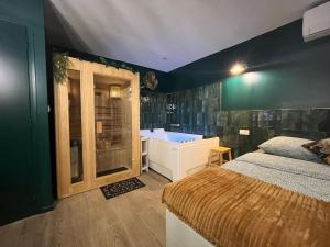 Appartements Le SPEAK EASY / JACUZZI ET SAUNA : photos des chambres